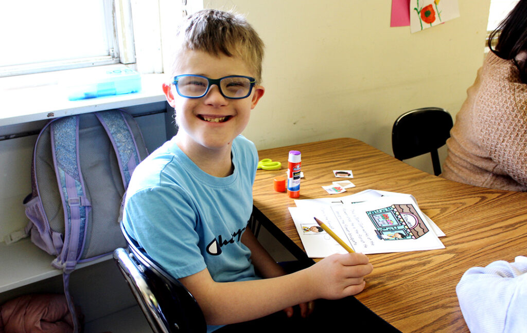 ECLC boy at desk